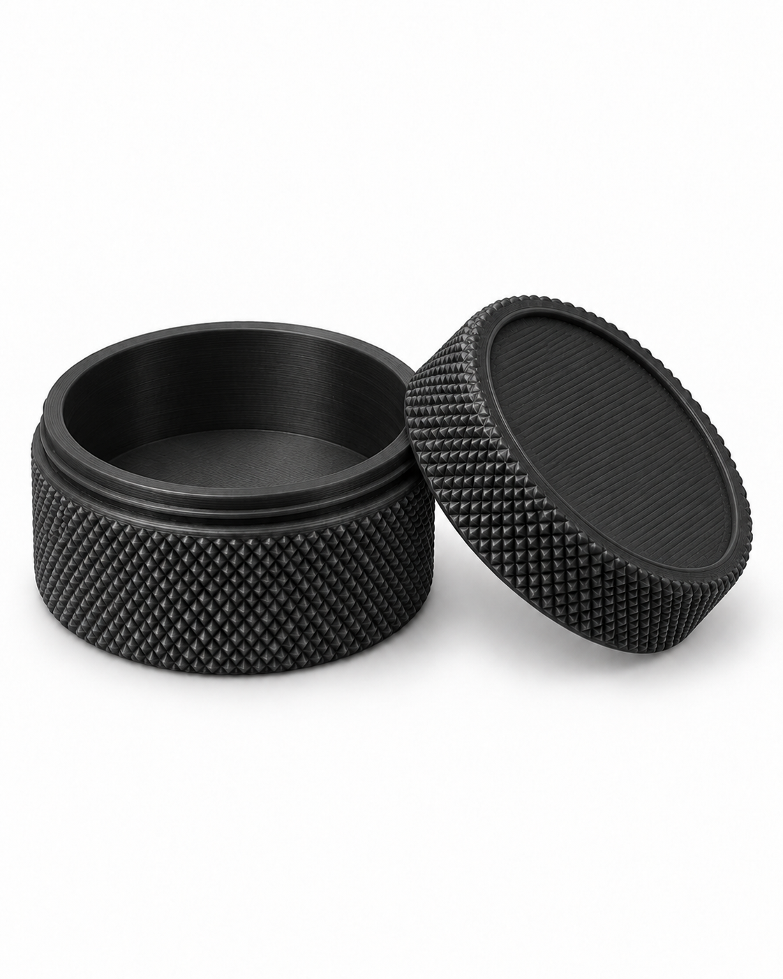 Black 3D-printed small-parts container, open with lid beside it